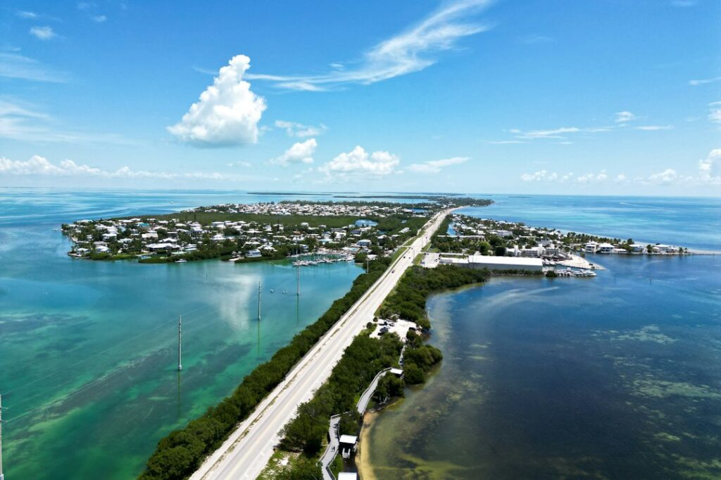 Aerial view of the Florida Keys Overseas Highway and water — photo by Julius Hildebrandt on Unsplash