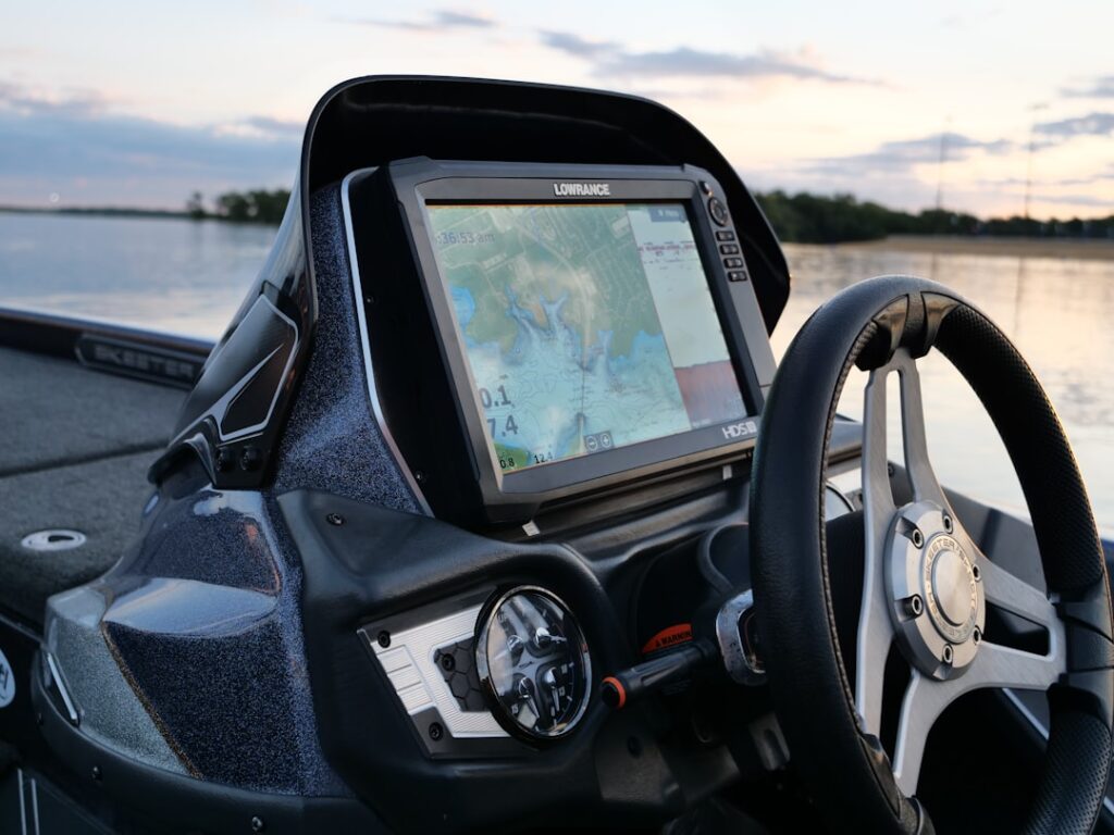 Fish finder and marine electronics display on a fishing boat console
