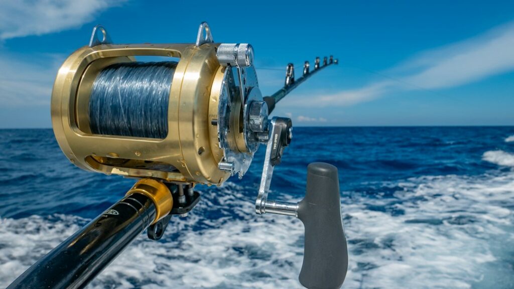 Heavy conventional trolling reel overlooking blue ocean water