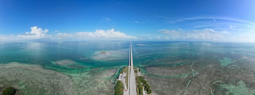 Aerial view of a Florida Keys bridge and ocean — photo by Zoshua Colah on Unsplash
