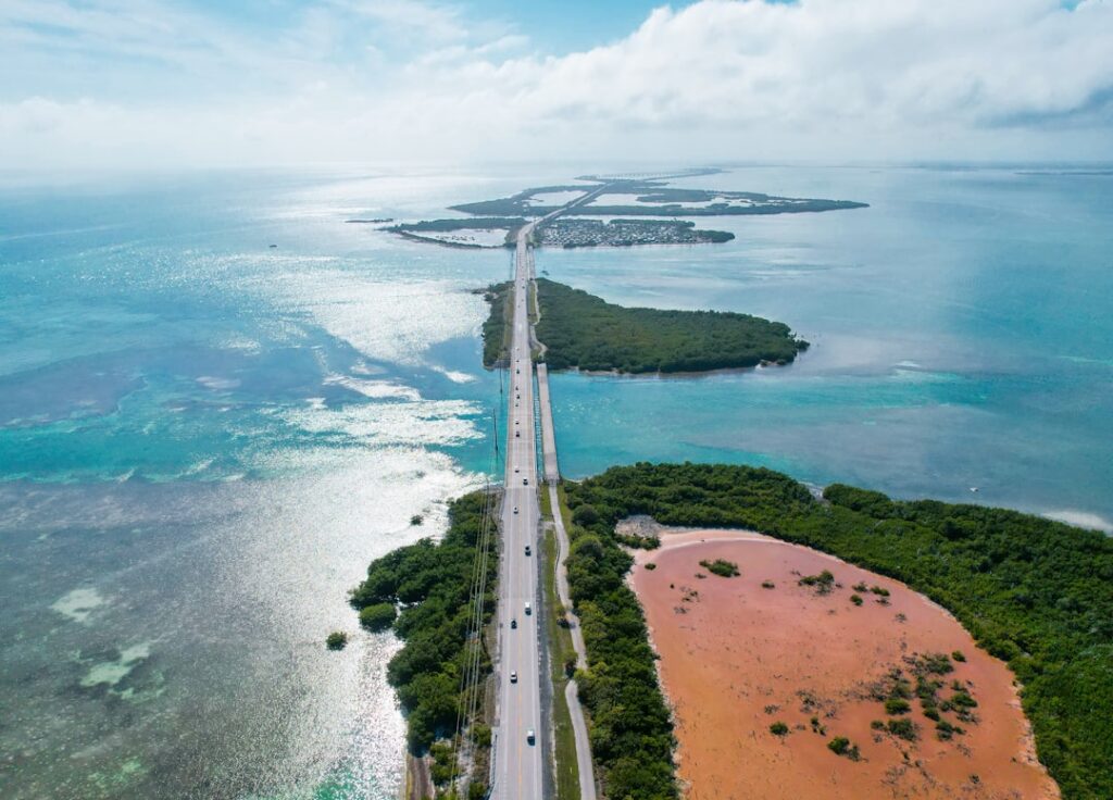 Florida Keys bridge and clear blue water aerial view — photo by Zoshua Colah on Unsplash