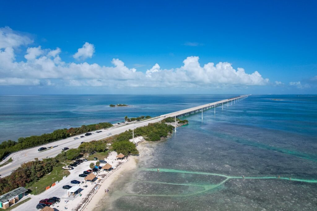 Historic Florida Keys bridge surrounded by turquoise water — photo by Zoshua Colah on Unsplash